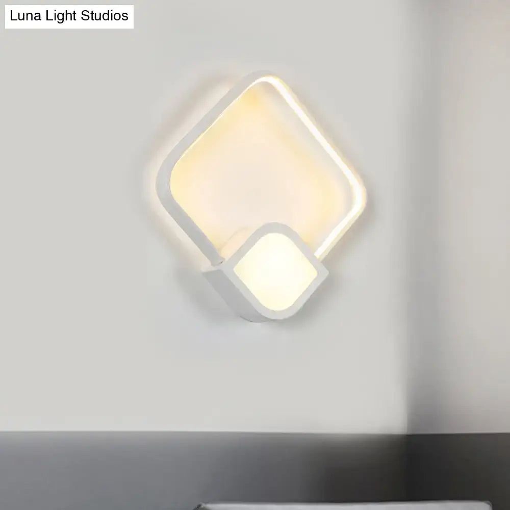 White acrylic square LED wall sconce by Decorbites with overlapping frame, warm light on Tampa Home & Garden Store