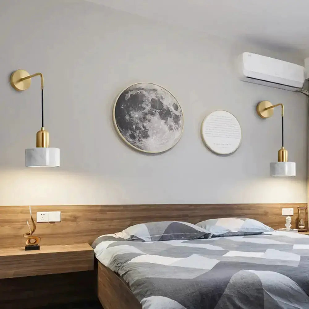 Pair of modern gold and black marble pendant lights by Decorbites with white marble shades on Tampa Home & Garden Store