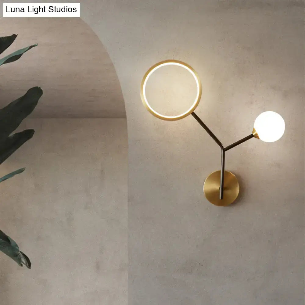 Gold cream glass compact wall sconce with circular ring light and globe bulb, brass finish on Tampa Home & Garden Store