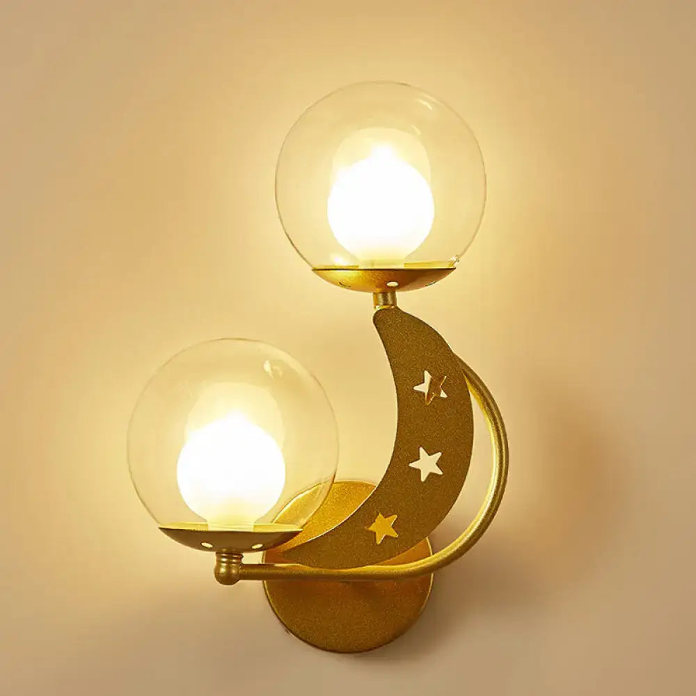 Decorbites Gold Ball Wall Sconce with dual glass globes and a curved star-cut crescent arc on Tampa Home & Garden Store