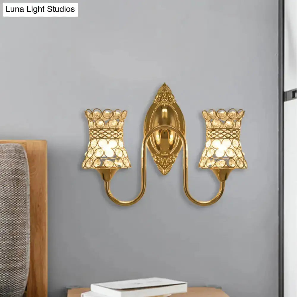 Modern gold crystal swirl wall sconce by Decorbites with dual lights and ornate backplate on Tampa Home & Garden Store