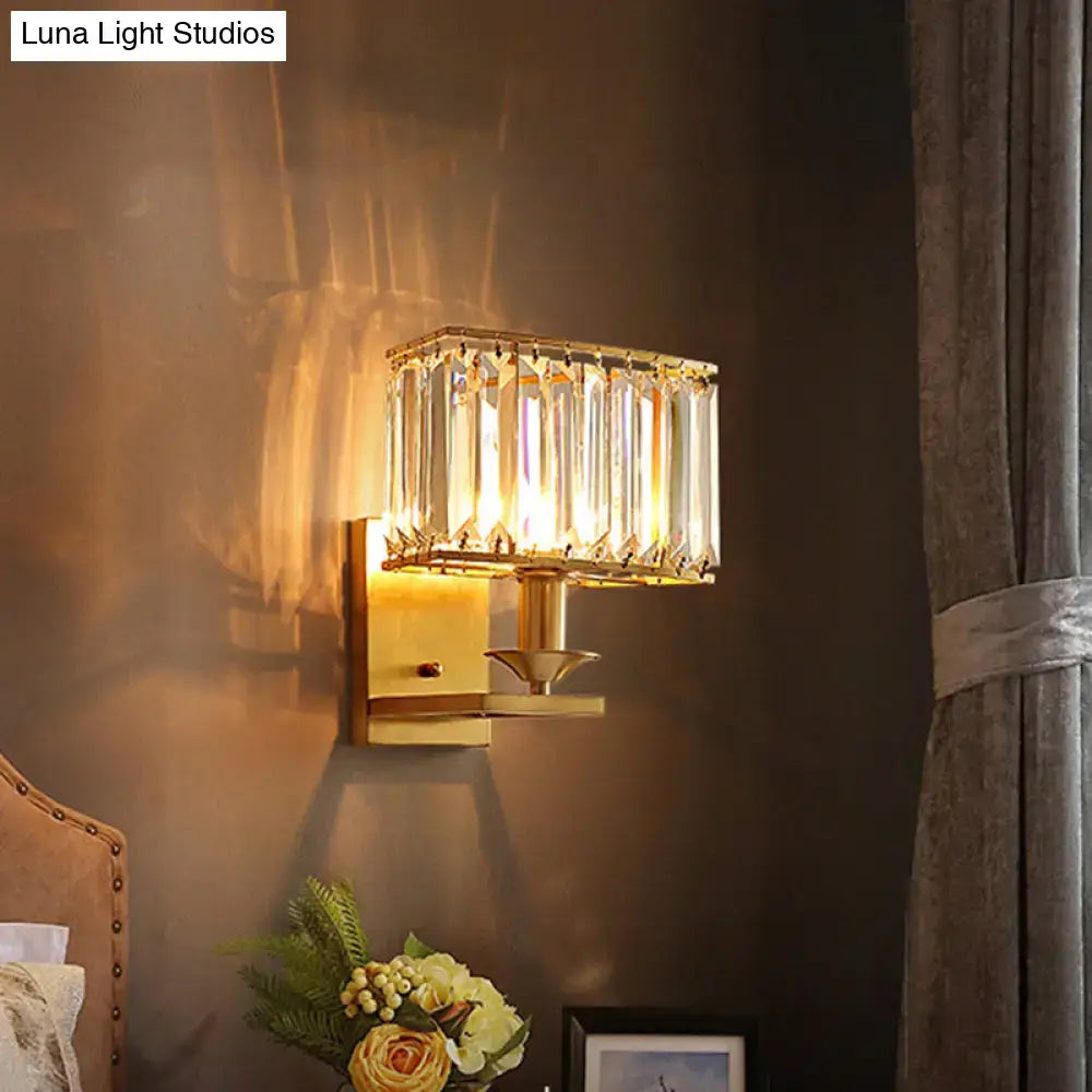 Gold Crystal Living Sconce by Decorbites on wall with crystal prisms, warm glow on Tampa Home & Garden Store