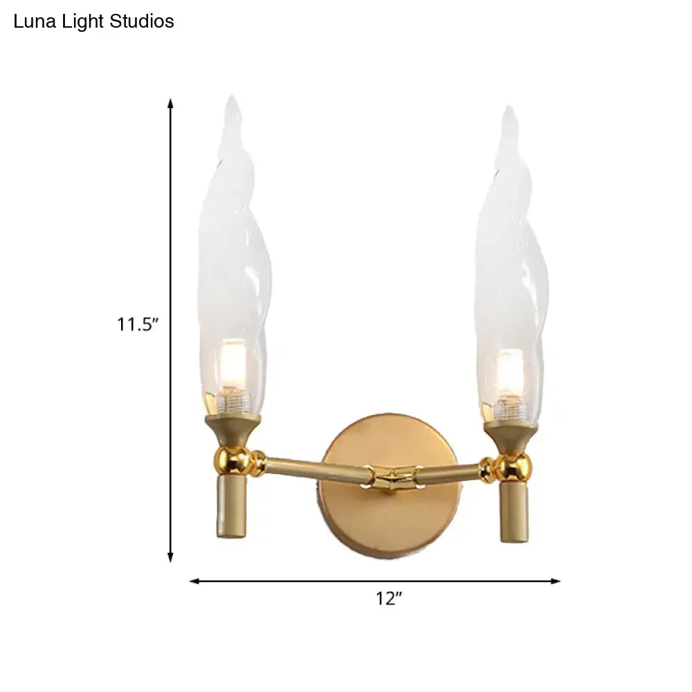 Gold double arm wall sconce by Decorbites with brass finish and candle-style bulbs on Tampa Home & Garden Store