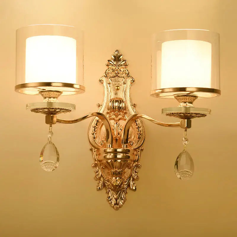 Gold Crystal Double Cylinder Wall Sconce with ornate backplate and crystal drops on Tampa Home & Garden Store
