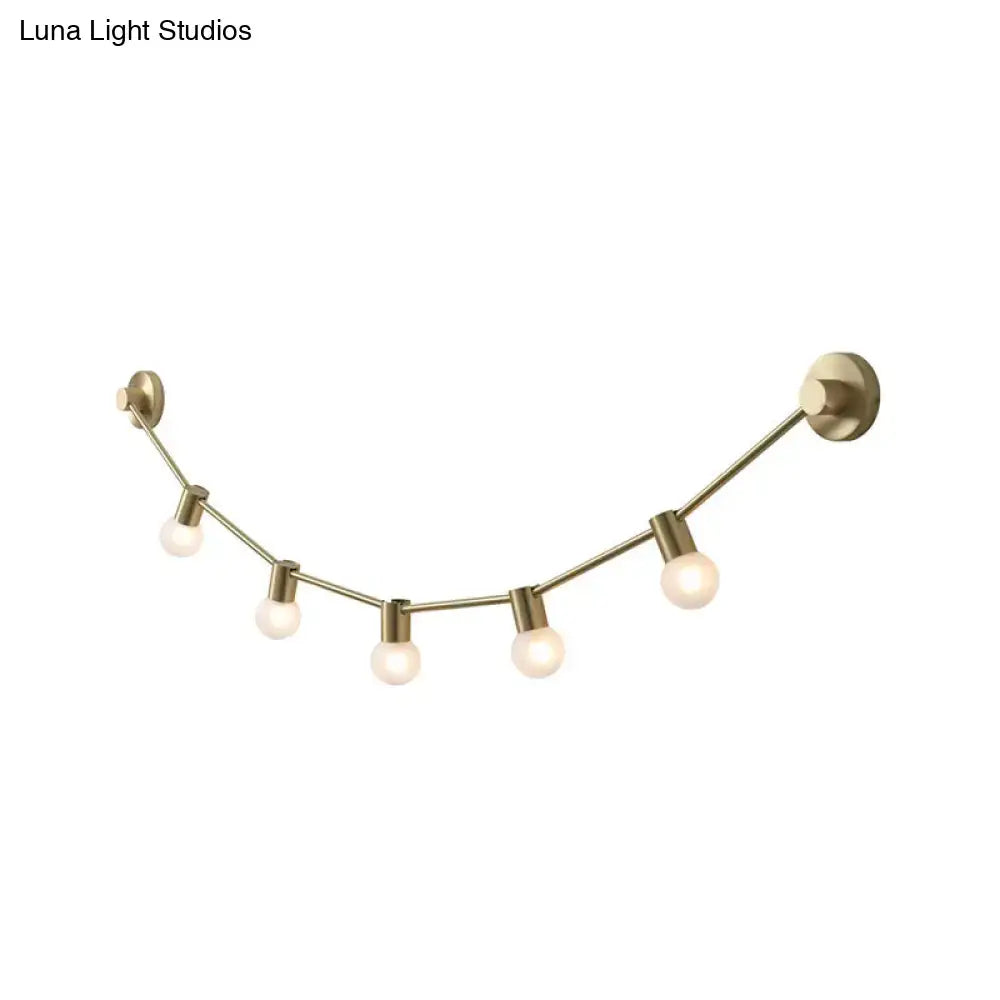 Gold bubble wall light with seven globe bulbs in brass finish, curved wall-mounted arc design on Tampa Home & Garden Store
