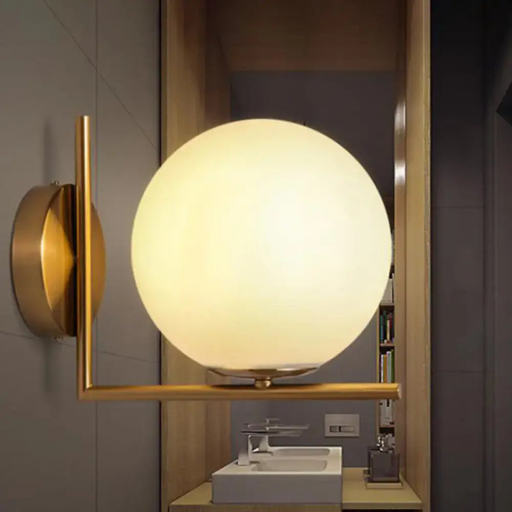 Gold Opal Glass Wall Light by Decorbites, brass frame with round frosted glass globe on Tampa Home & Garden Store