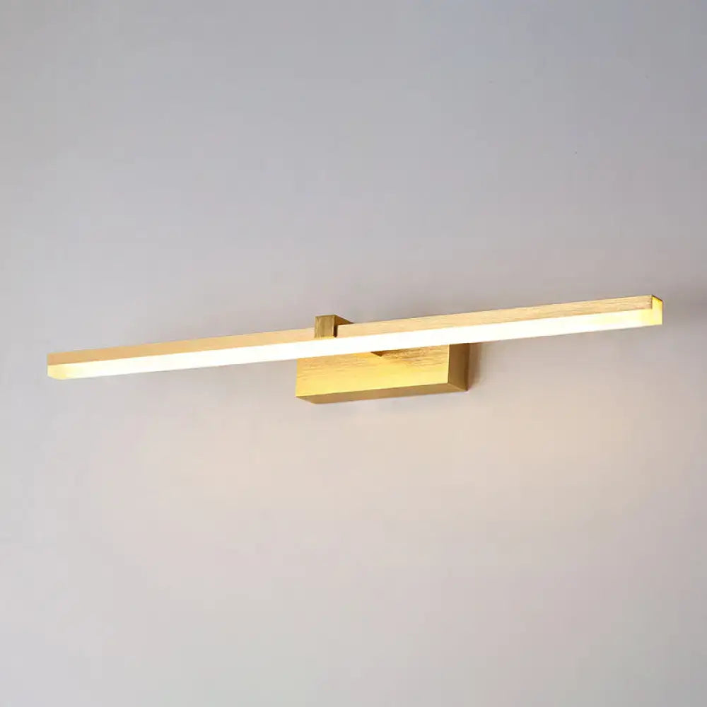 Gold LED Vanity Light by Decorbites, horizontal brass bar on square wall plate, warm glow on Tampa Home & Garden Store
