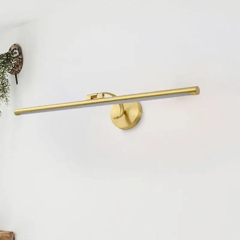 Gold pipe vanity light by Decorbites with brass finish and wall-mount round backplate on Tampa Home & Garden Store