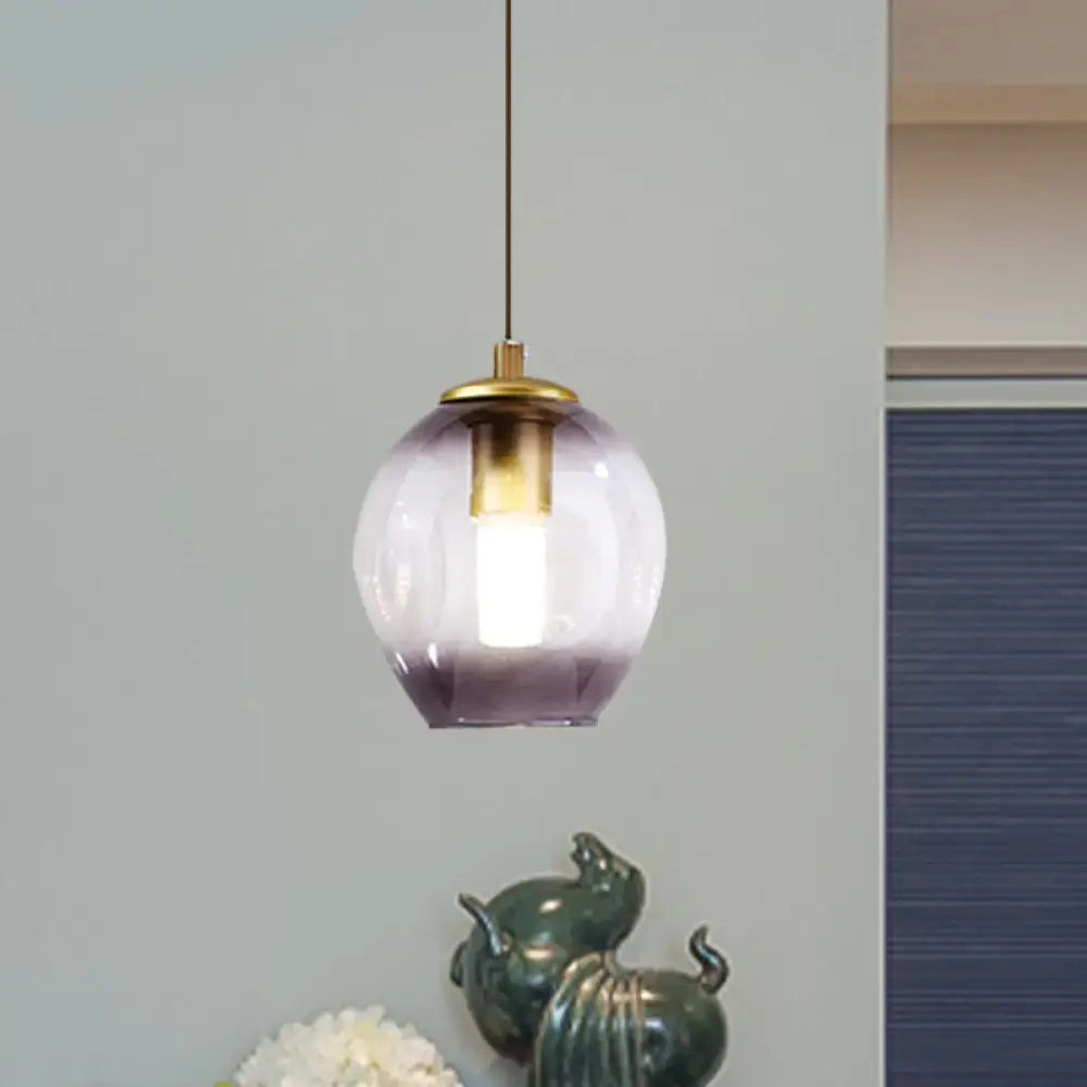 Gold Tulip Wall Lamp by Decorbites; brass fitting with lavender-tinted glass shade pendant, two green elephants nearby on Tampa Home & Garden Store