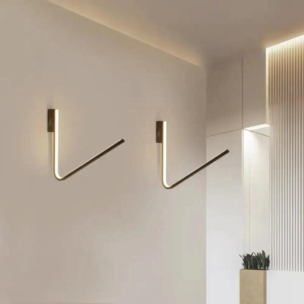 Gold V-shaped wall light pair by Decorbites; modern gold wall sconces with warm LED glow on Tampa Home & Garden Store