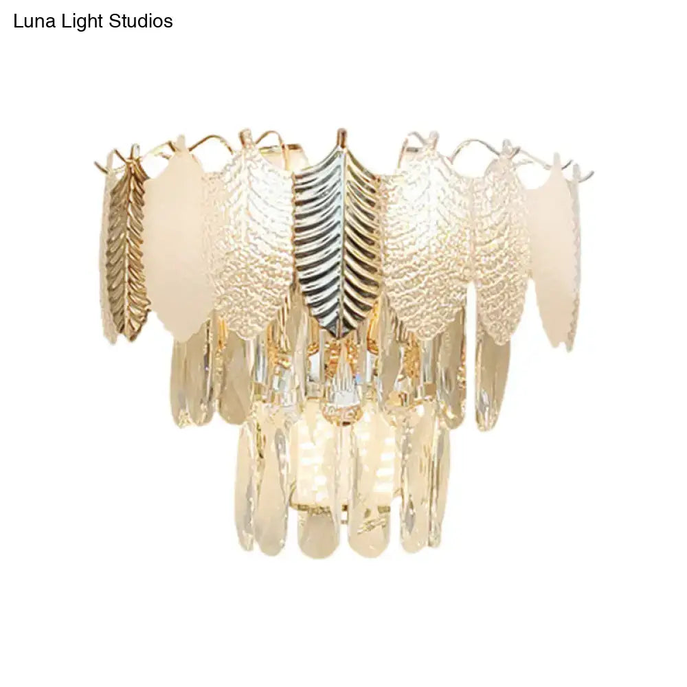 Gold acrylic leaf wall sconce with hanging leaf panels by Decorbites on Tampa Home & Garden Store