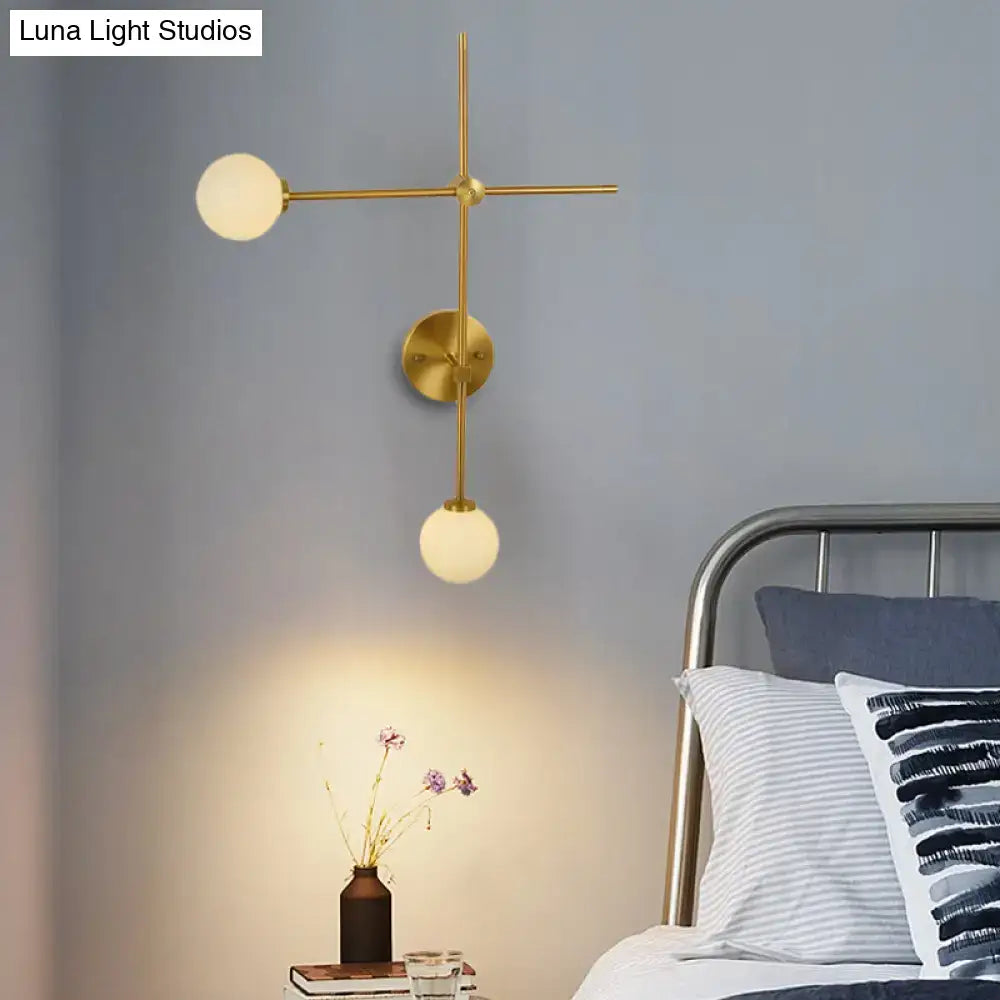 Gold glass wall lamp sconce with crossbar arms and two frosted globes, modern decor on Tampa Home & Garden Store