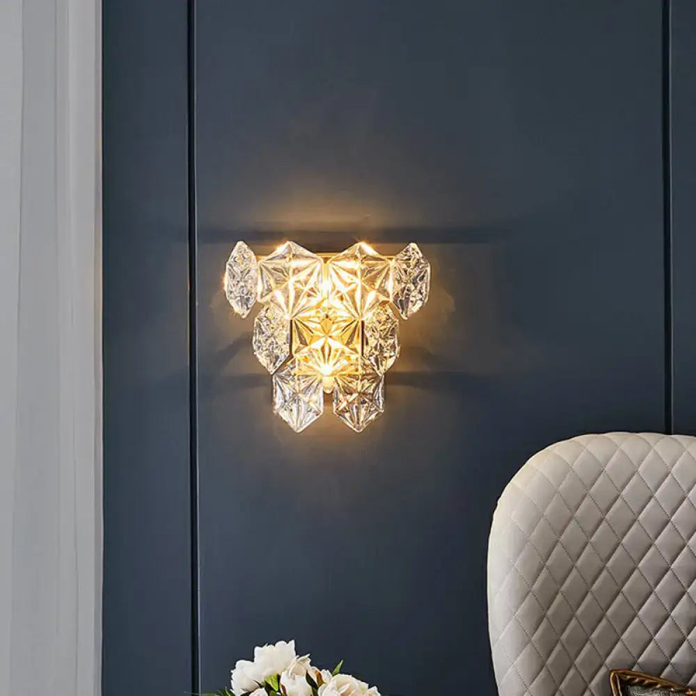 Decorbites gold hexagon glass postmodern wall sconce with crystal facets, warm glow on navy wall on Tampa Home & Garden Store