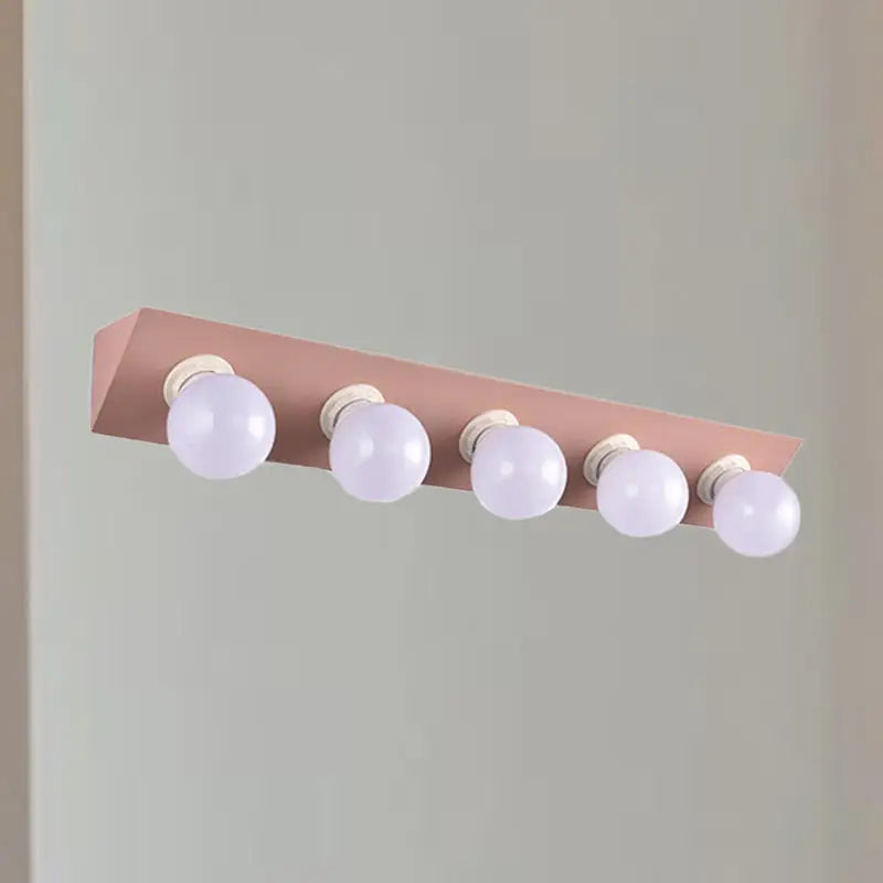 Pink yellow vanity sconce with five bare bulbs by Decorbites on Tampa Home & Garden Store