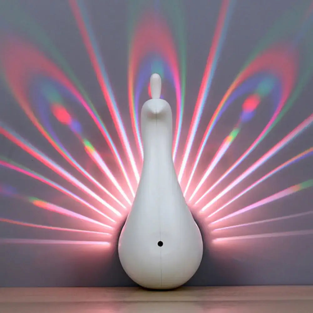 Peach-shaped glass wall sconce, white finish, projecting rainbow light rays on the wall on Tampa Home & Garden Store