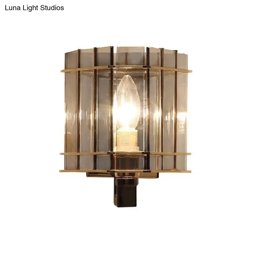 Gray glass rectangular frame sconce with brass bands and exposed bulb by Decorbites on Tampa Home & Garden Store