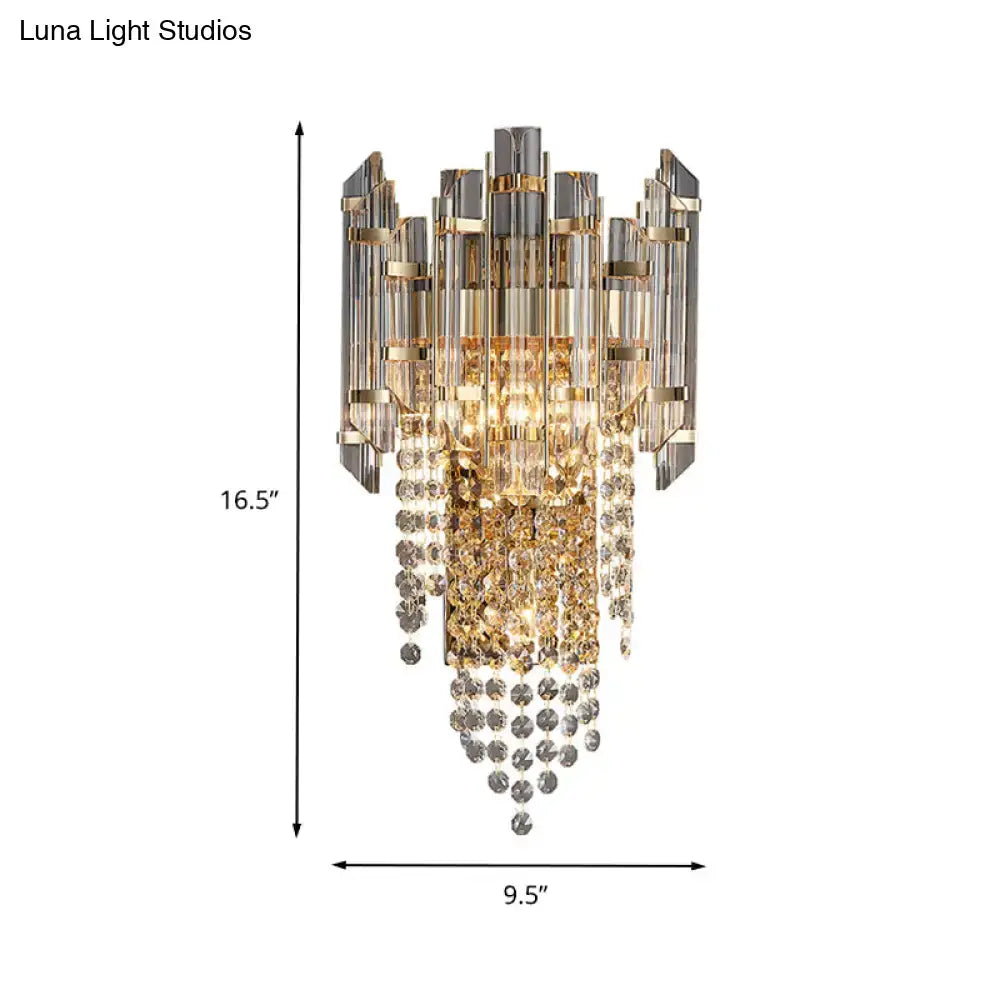 Gray crystal wall sconce with gold-tone metal accents and hanging crystal strands by Decorbites on Tampa Home & Garden Store
