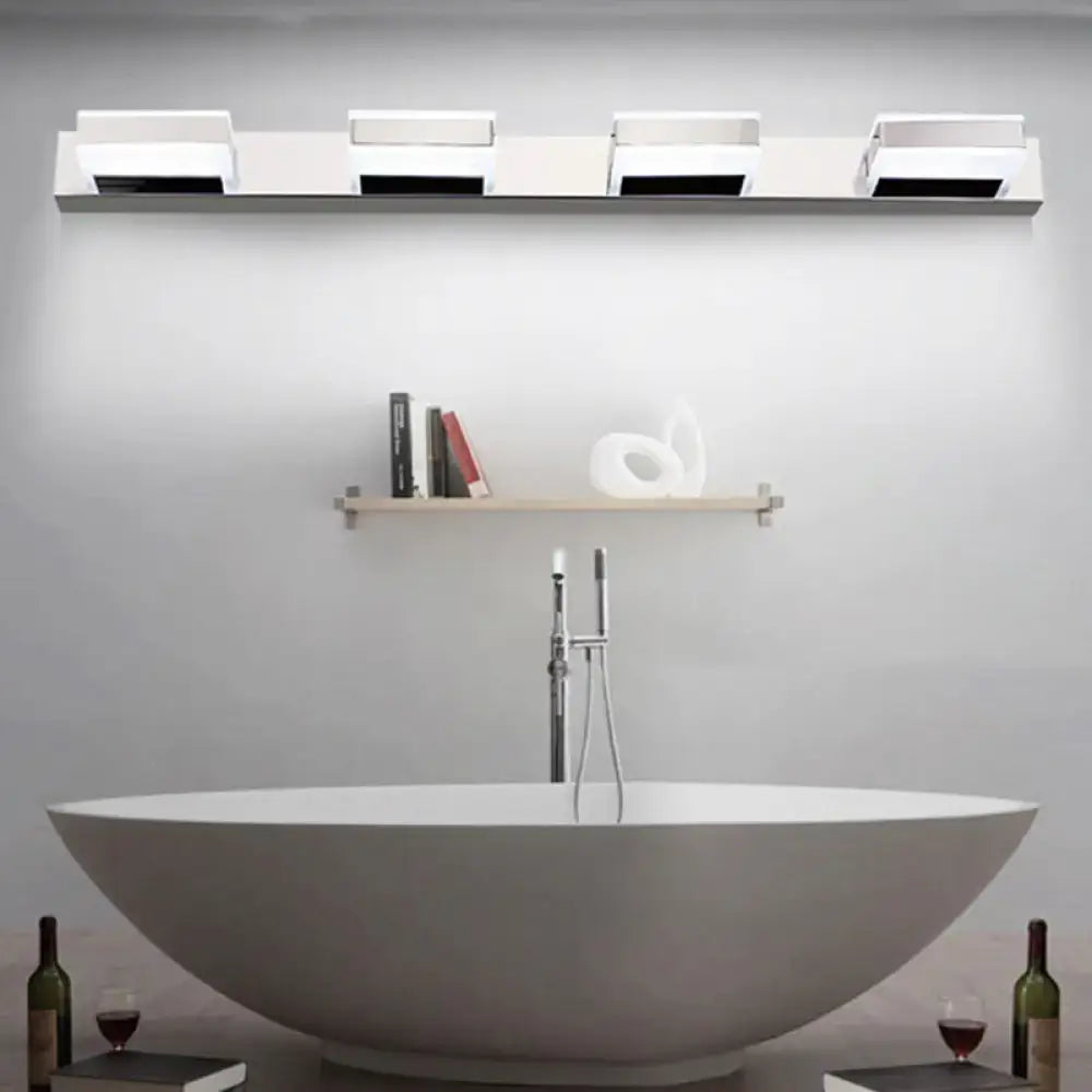 Chrome LED vanity sconce with four square LED heads on a slim wall bar, modern bathroom scene on Tampa Home & Garden Store