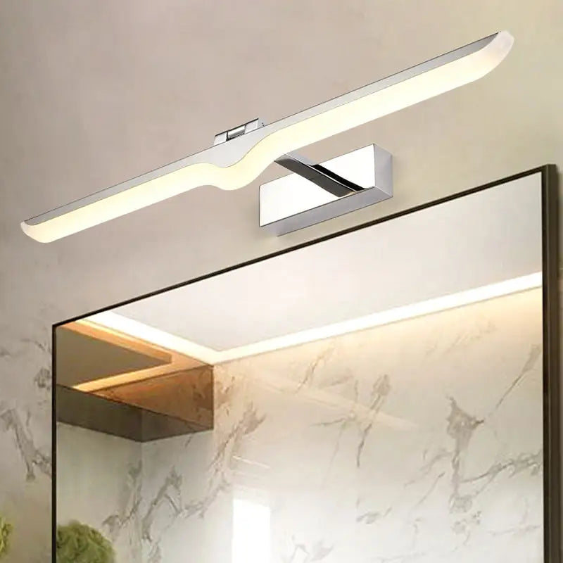 Chrome acrylic wall light Decorbites with a curved bar, wall-mounted above a bathroom mirror on Tampa Home & Garden Store