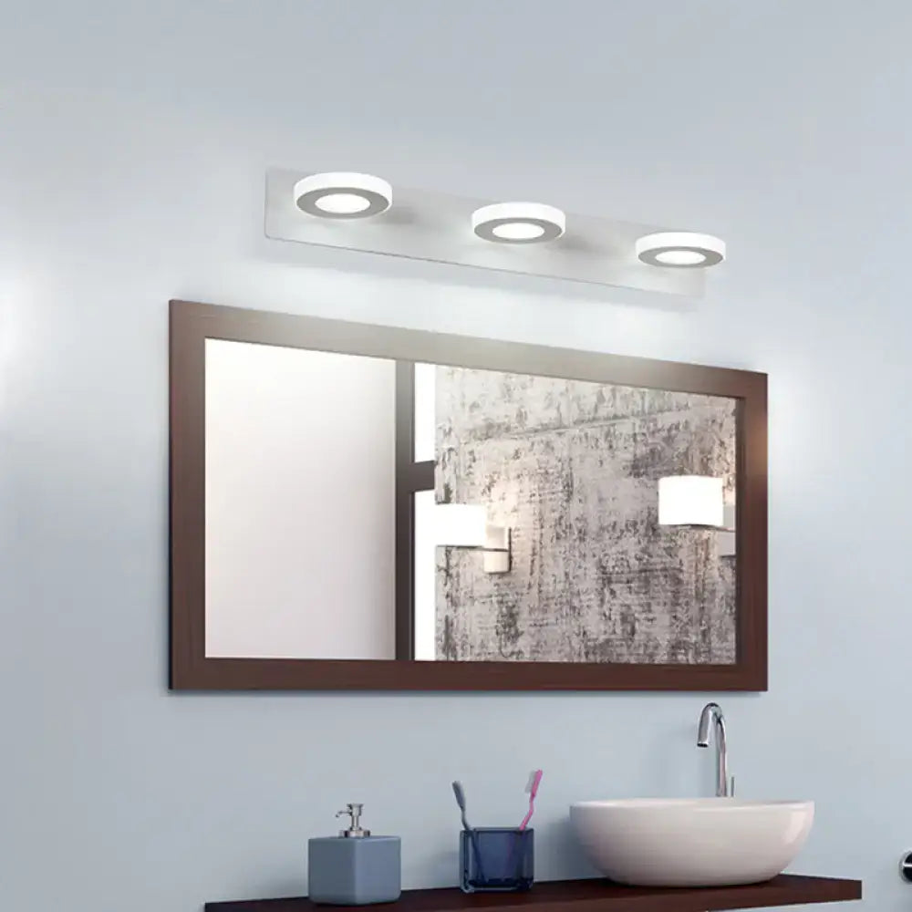 White adjustable wall light with three circular ring LEDs above bathroom mirror Decorbites on Tampa Home & Garden Store