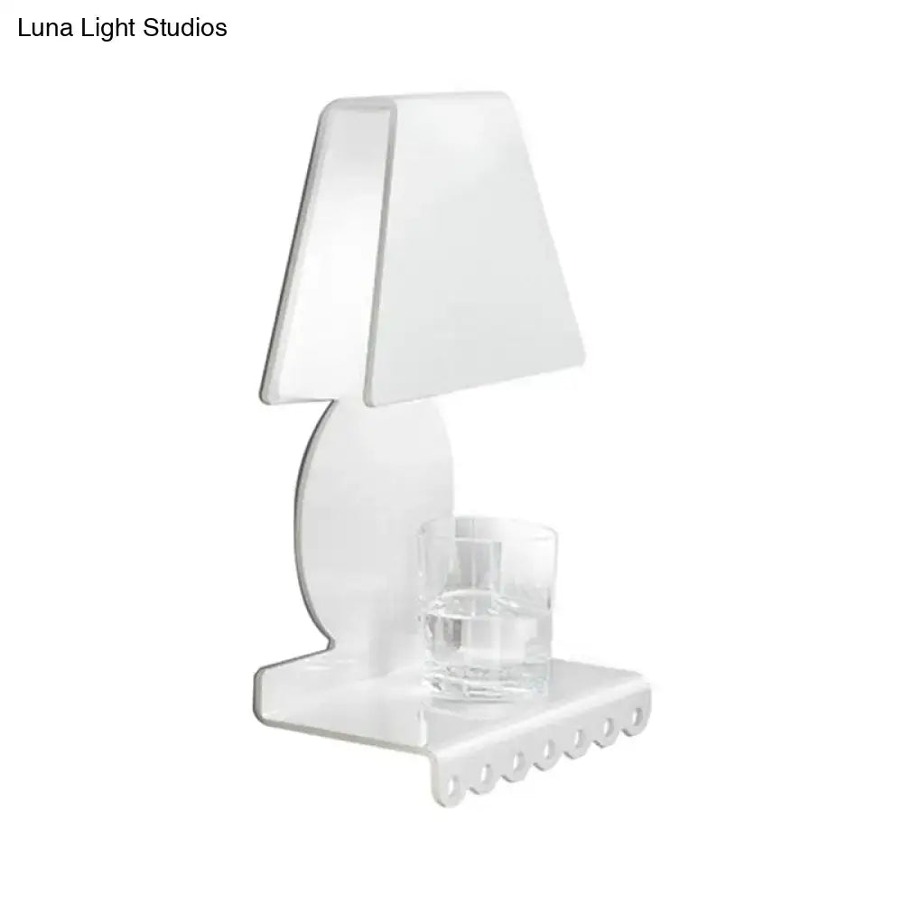White trapezoid wall sconce by Decorbites with curved backplate and glass votive holder on base on Tampa Home & Garden Store