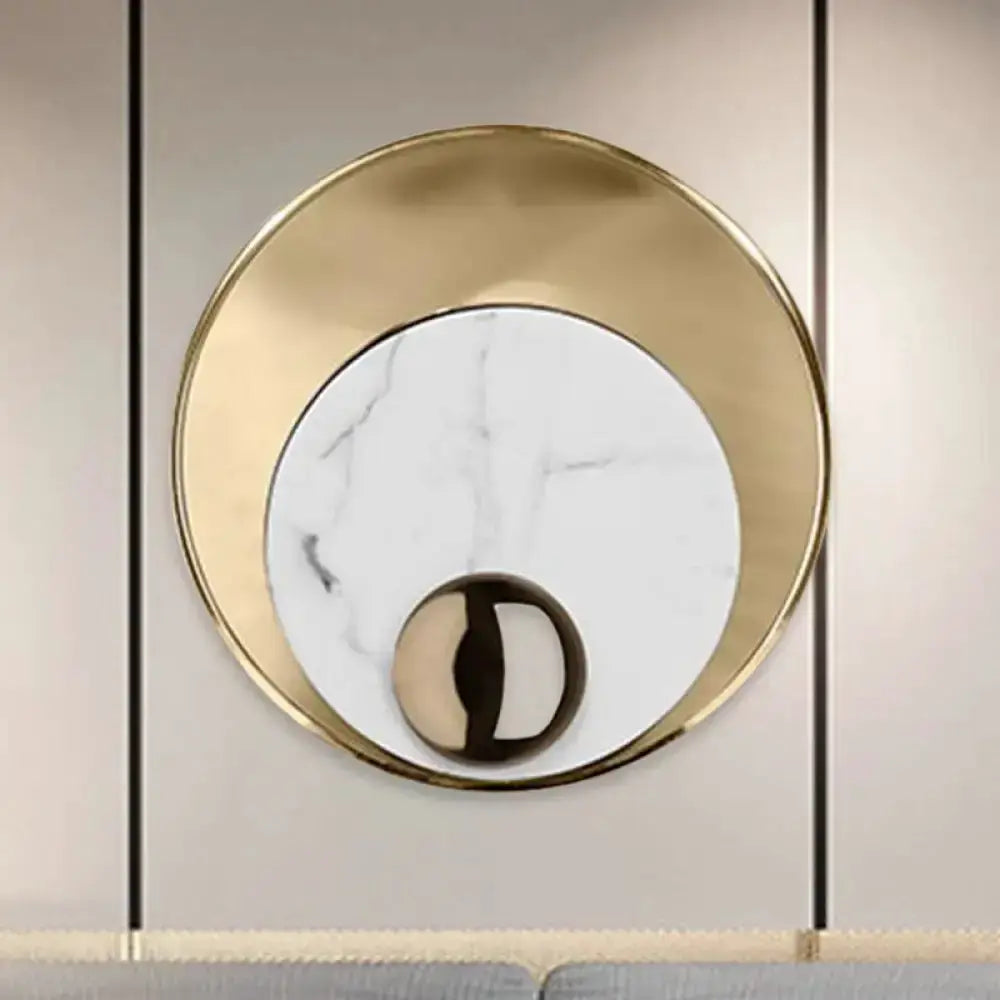 Modernist LED wall sconce by Decorbites with gold circular frame and white marble center on Tampa Home & Garden Store