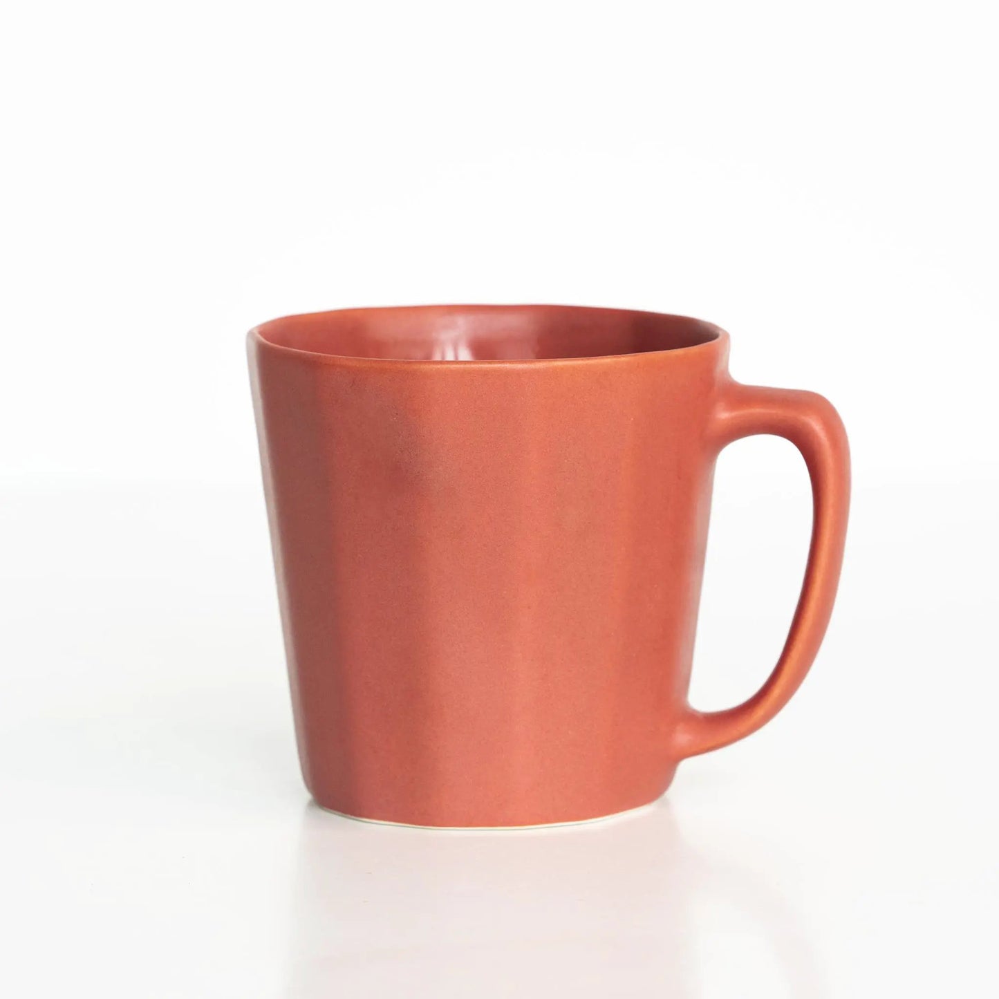 Monday Mug handmade porcelain coffee cup in warm terracotta orange on Tampa Home & Garden Store