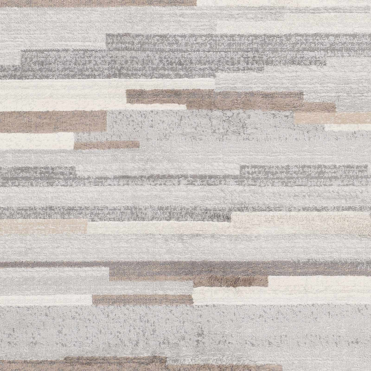 Monkland Area Rug by Boutique Rugs, neutral abstract patchwork in ivory, beige, and gray on Tampa Home & Garden Store