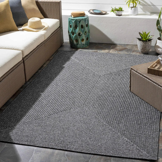 Black braided faux-jute outdoor rug from Boutique Rugs, Moxley collection, patio-ready on Tampa Home & Garden Store