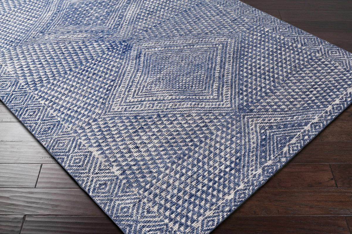 Boutique Rugs Moyne blue geometric area rug with indigo tones on Tampa Home & Garden Store