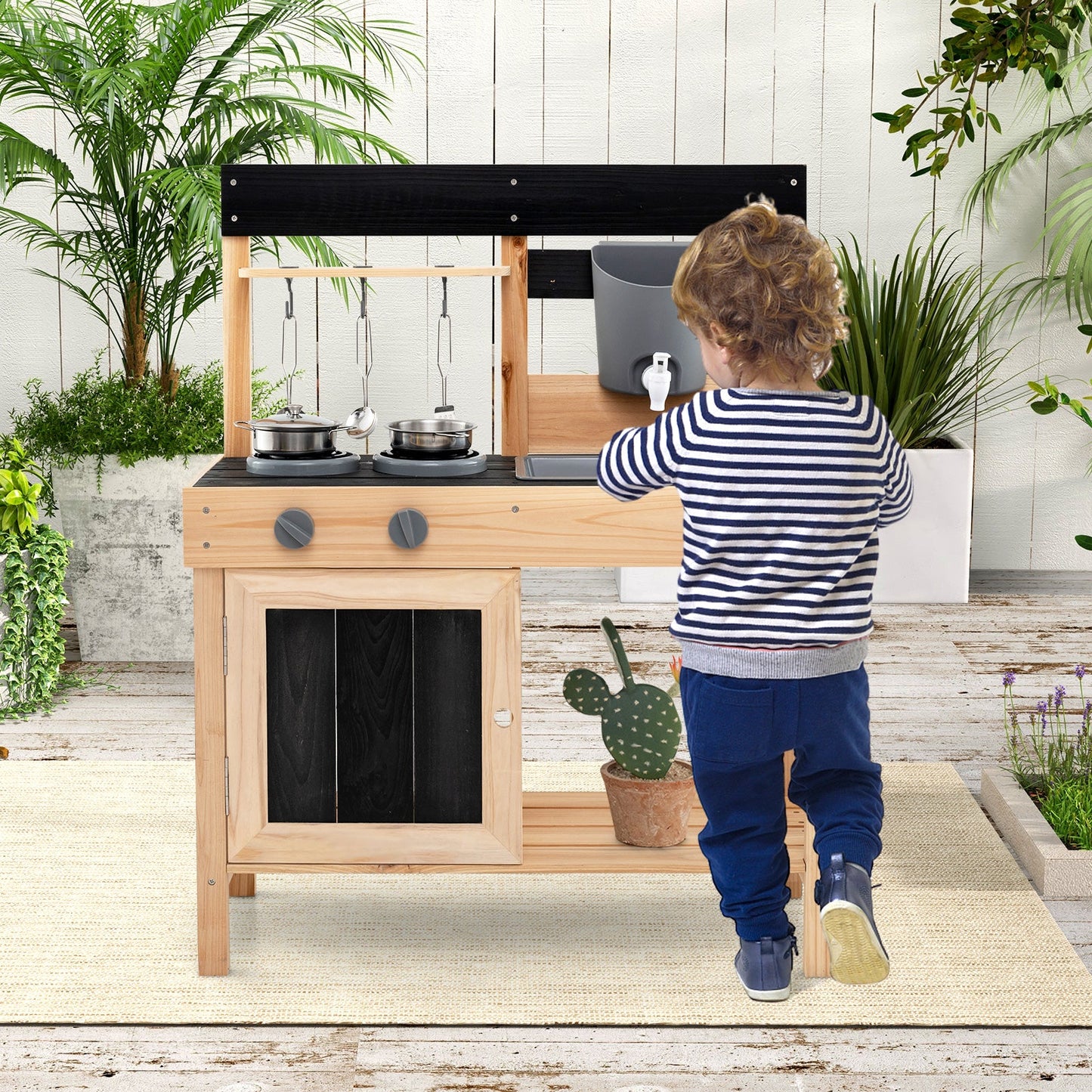 Outdoor mud kitchen playset with removable sinks, natural wood frame, and black hood on Tampa Home & Garden Store