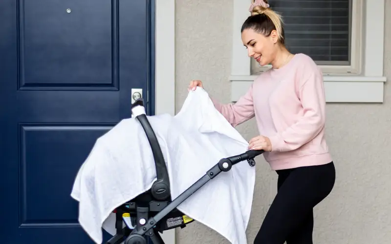 Muslin car seat cover in white organic cotton for baby stroller outdoors on Tampa Home & Garden Store
