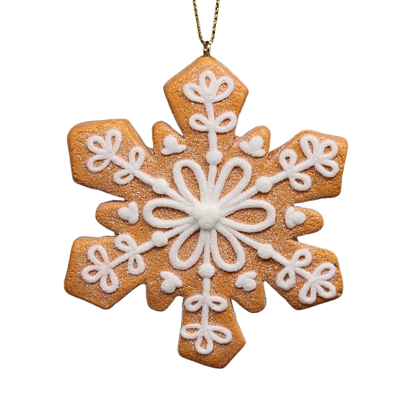 Gingerbread snowflake ornament with white icing detailing and gold hanging loop on Tampa Home & Garden Store