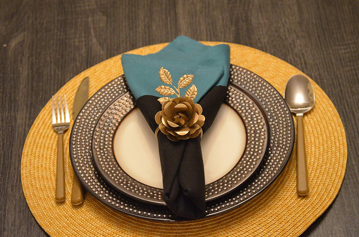 Vibhsa gold rose napkin rings, set of 4, handcrafted on teal and black napkins on Tampa Home & Garden Store