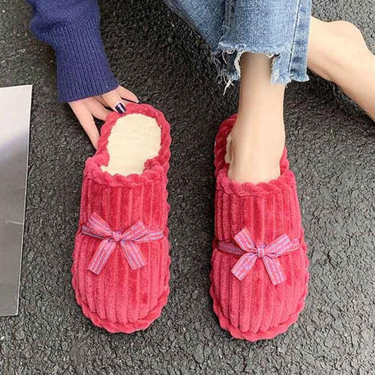 Stevvex pink fuzzy slippers with ribbed texture and bow accents, memory foam lining, pair on Tampa Home & Garden Store