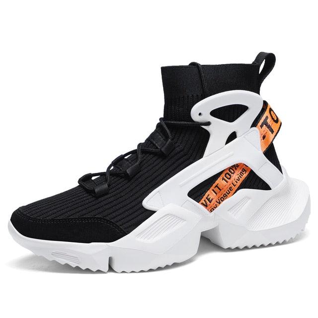 Stevvex black mesh sock-style sneakers with white chunky sole and orange branding strap on Tampa Home & Garden Store
