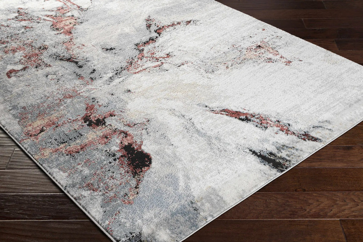 Kirkland Marble Rug in Silver and Red, abstract marble pattern on wood floor on Tampa Home & Garden Store