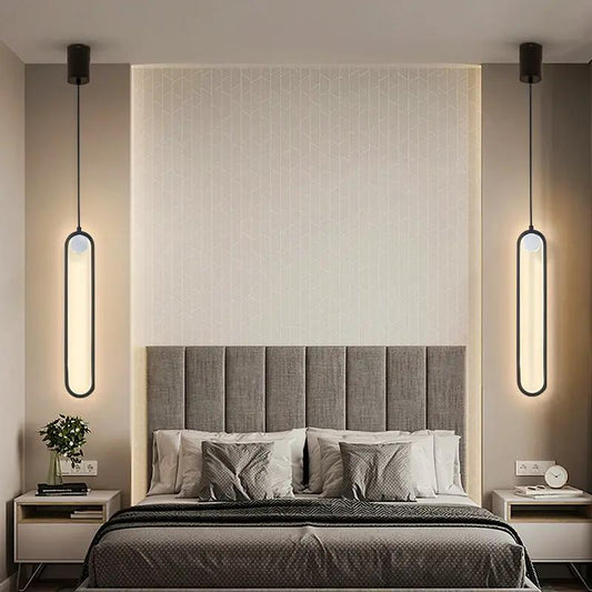 Nordic Minimalist Oval Bedside Chandeliers, twin black-framed oval pendants beside a bed on Tampa Home & Garden Store
