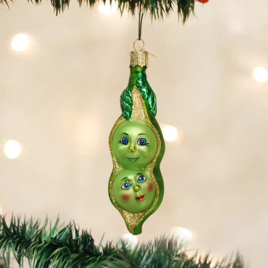 Old World Christmas Two Peas in a Pod ornament, glass blown, green with smiling faces on Tampa Home & Garden Store