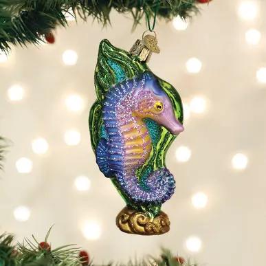 Hand Painted Seahorse Glass Ornament purple body with green fins hanging on Christmas tree on Tampa Home & Garden Store