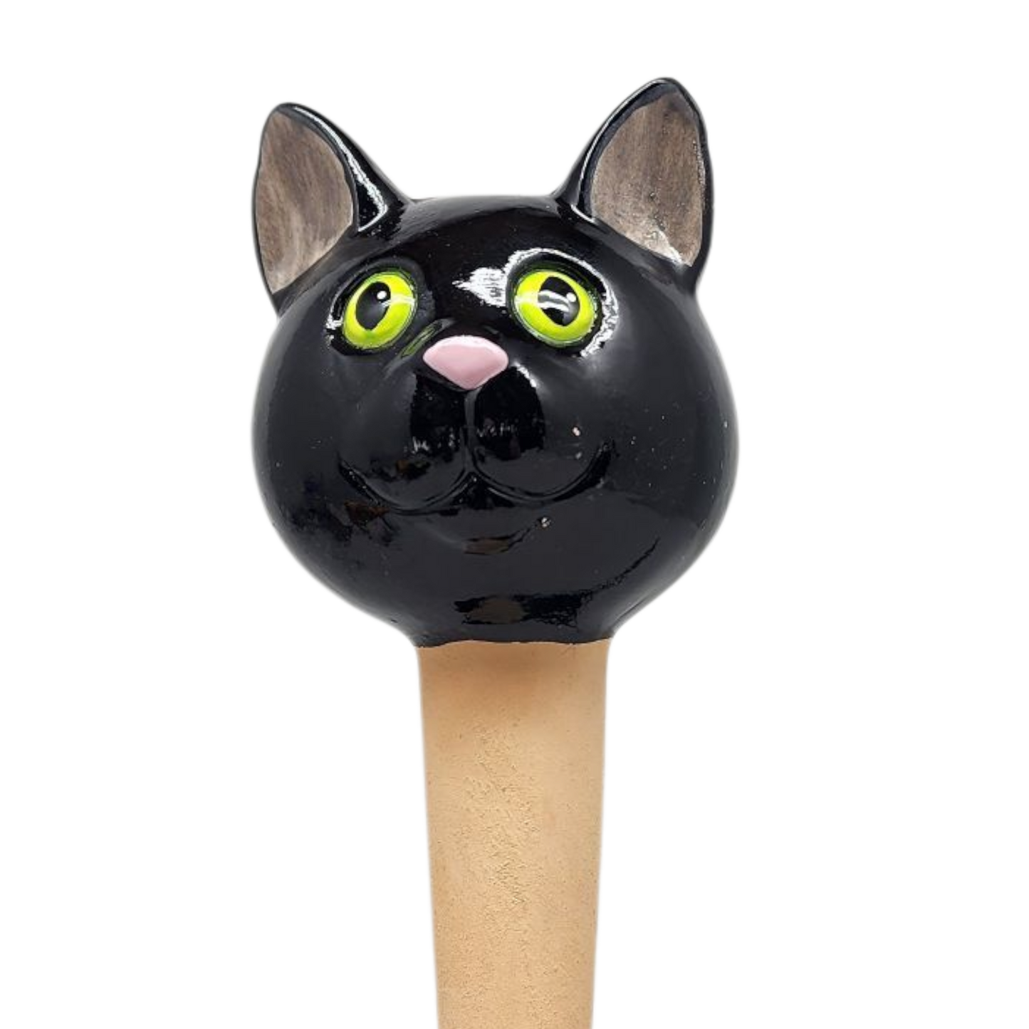 Black ceramic cat figurine with bright yellow eyes atop a cork plant stake on Tampa Home & Garden Store