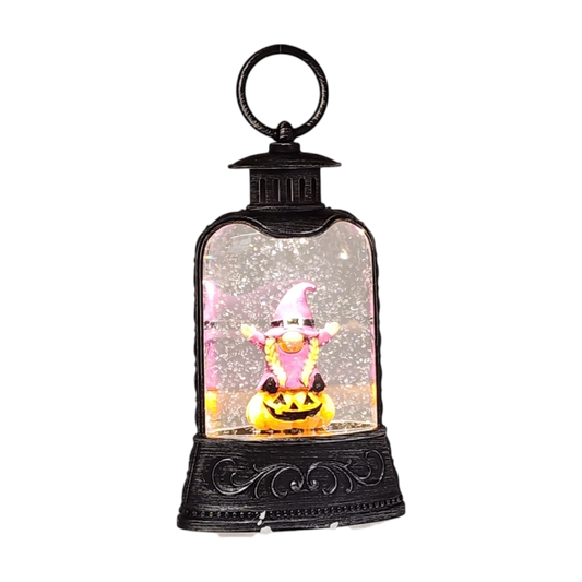 Lighted Waterglobe Lantern Wizard Gnome, pink-clad figure inside glitter globe, black ornate base on Tampa Home & Garden Store
