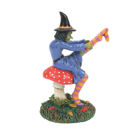 Darn Good Darn Figurine Witch on red mushroom, blue robe, black hat, striped orange-purple scarf on Tampa Home & Garden Store