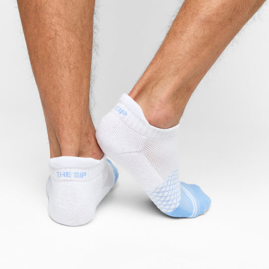Ole Miss Ankle Socks 2 Pack white socks with light blue pattern shown on legs on Tampa Home & Garden Store