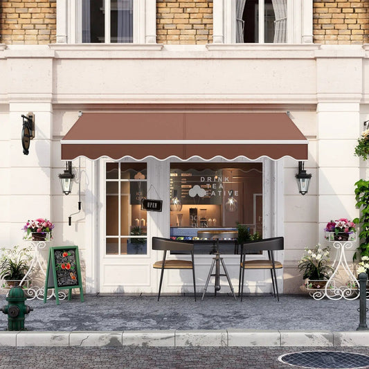 Retractable Awning DirectDeals brown fabric with white trim over storefront cafe seating on Tampa Home & Garden Store