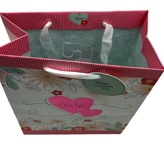 Floral Love Gift Bag for Valentine's Day with pink striped handles and teal interior on Tampa Home & Garden Store
