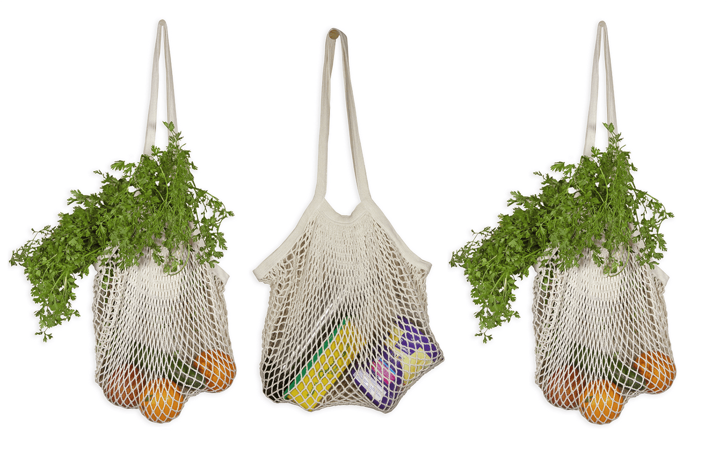 Reusable organic cotton mesh totes by Organic Cotton Mart filled with greens and oranges on Tampa Home & Garden Store