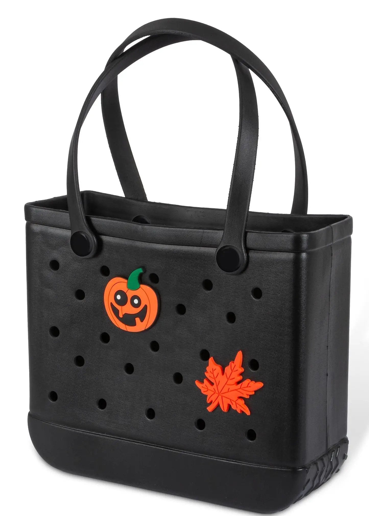 Charming black tote with pumpkin charm and orange leaf accents on perforated bag on Tampa Home & Garden Store