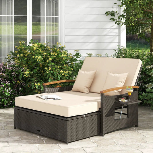Outdoor wicker daybed with beige cushions, folding back panels, and wicker side table on Tampa Home & Garden Store