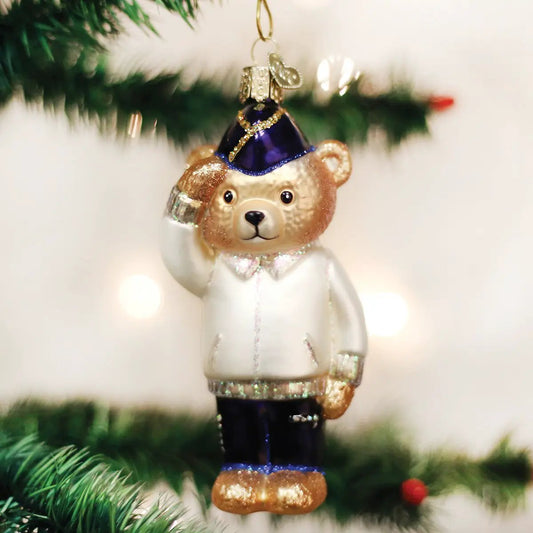 Veteran Bear Glass Ornament with white coat and glittery blue hat, saluting pose on Tampa Home & Garden Store